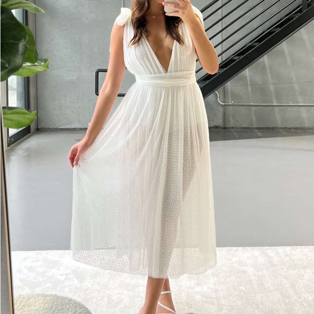 This stunning pleated mesh midi dress with plunging V cut neckline